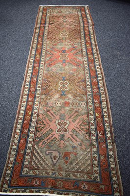Lot 403 - A Middle Eastern wool runner, with a geometric...