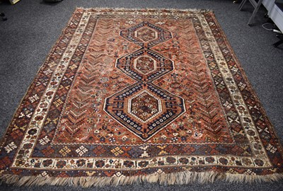 Lot 404 - A Middle Eastern wool rug, red ground, with...