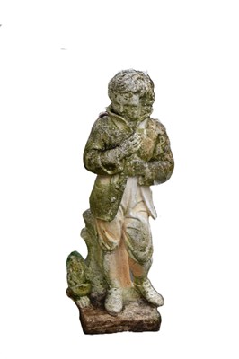 Lot 407 - A reconstituted stone statue of a young boy...
