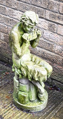 Lot 408 - A reconstituted stone statue of a figure...