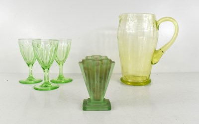 Lot 67 - A vintage uranium glass water jug, three wine...