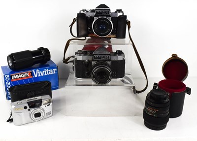 Lot 135 - A group of vintage cameras and lenses, to...