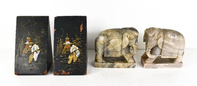 Lot 102 - A pair of Chinese grey marble elephants book...