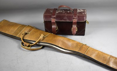 Lot 27 - A leather and wool lined gun slip together...