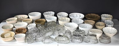 Lot 115 - A quantity of Victorian and later jelly moulds,...