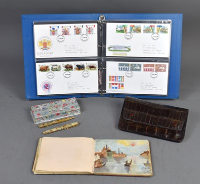 Lot 23 - An album of First Day Covers together with a...
