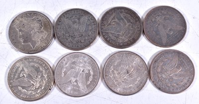 Lot 312 - A group of eight US silver Morgan dollars...