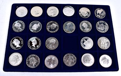 Lot 318 - A collection of silver and silver proof coins...