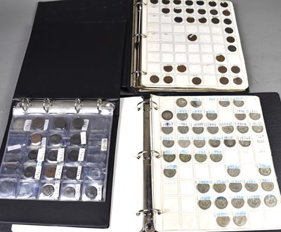 Lot 291 - Three albums of coins containing silver...