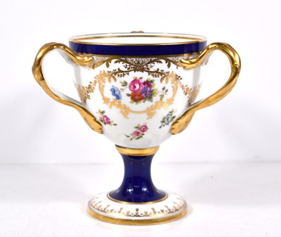 Lot 77 - A Coalport three handled porcelain loving cup,...