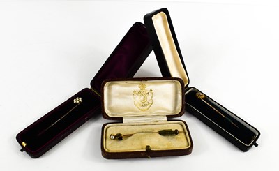 Lot 166 - A gold (testing as) pearl and garnet set hat...