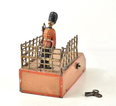 Lot 398 - A vintage clockwork soldier conducting on a...