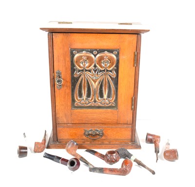 Lot 382 - An Art Nouveau oak smokers cabinet, the single...