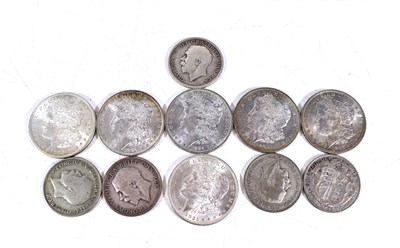 Lot 311 - A group of silver coins comprising six US...
