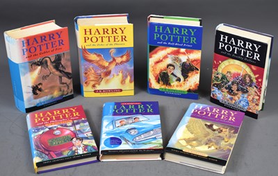 Lot 418 - A group of seven Harry Potter books by J. K....