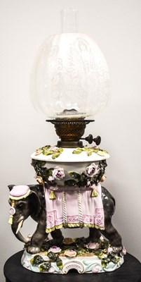 Lot 7 - A rare Sitzendorf porcelain oil lamp modelled...