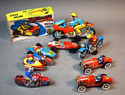 Lot 400 - A group of vintage tin plate vehicles to...