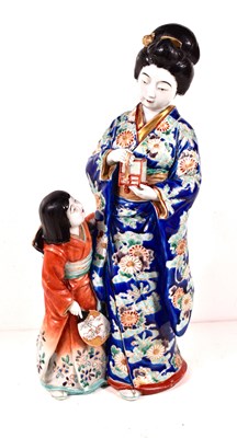 Lot 143 - A Japanese Kutani porcelain figurine group of...