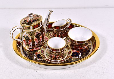 Lot 81 - A Royal Crown Derby miniature tea service...
