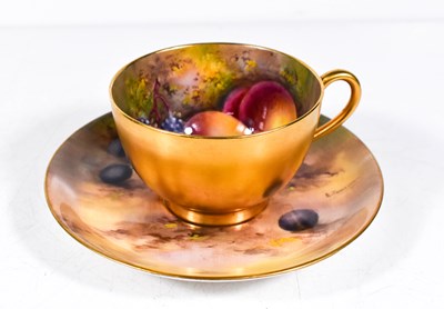 Lot 50 - A Royal Worcester teacup and saucer, painted...