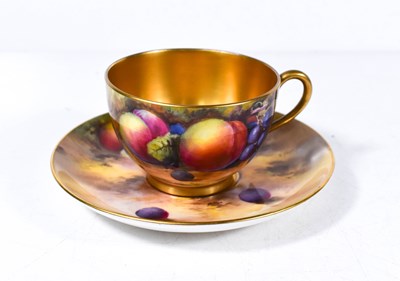 Lot 51 - A Royal Worcester teacup and saucer painted...