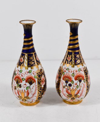 Lot 34 - A pair of Royal Crown Derby Imari Bud vases...