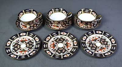 Lot 111 - A set of three cabinet cup and saucers by...