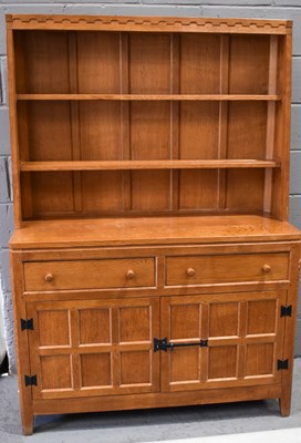 Lot 581 - Peter Heap the Rabbit Man: an oak dresser with...