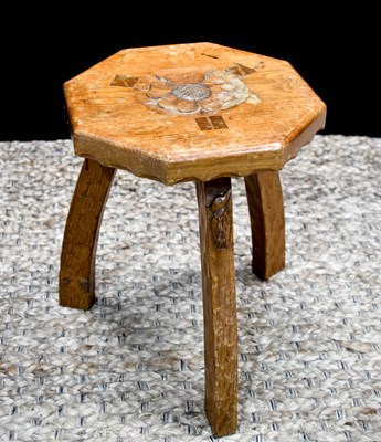Lot 573 - A Kingfisher Man three-legged oak stool with...