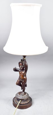 Lot 565 - A 19th century bronze cherub table lamp...