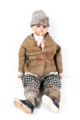 Lot 401 - A 19th century porcelain boy doll dressed in...