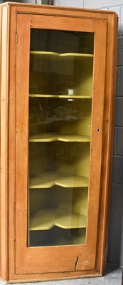 Lot 552 - An antique pine standing corner cupboard, the...