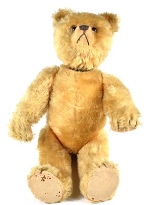 Lot 402 - A vintage 1950’s golden plush teddy bear with...