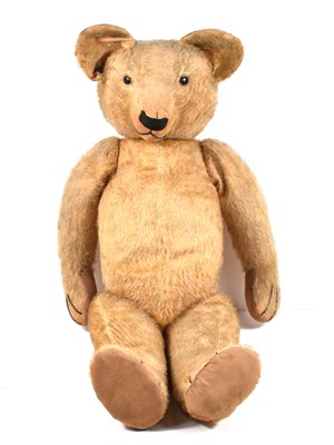 Lot 404 - An early 1930’s teddy bear, straw filled with...