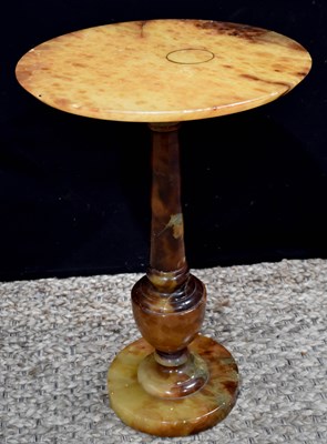 Lot 564 - An antique agate wine table with baluster...