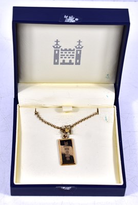 Lot 319 - A Royal Mint 9ct gold ingot on a 9ct gold...