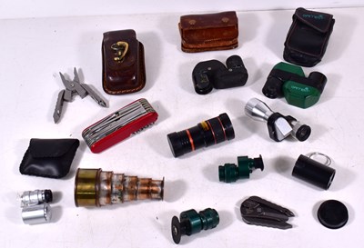 Lot 471 - A group of monoculars and multi tools to...