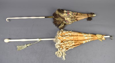 Lot 359 - Two Victorian parasols with painted wooden...