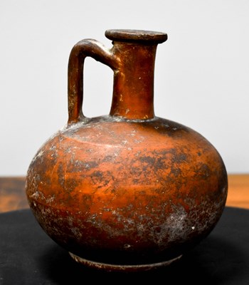 Lot 131 - A Roman red terracotta wine or oil jug,...