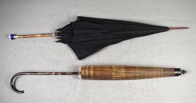 Lot 352 - A Victorian parasol with a bamboo handle...