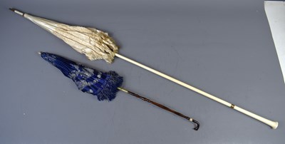 Lot 358 - Two Edwardian parasols: a cream satin example...