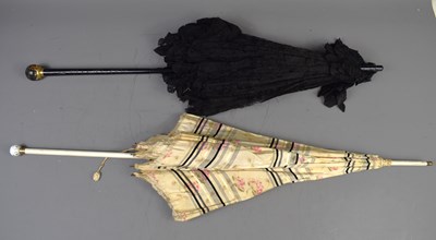 Lot 357 - A Victorian mourning parasol with ebonised...