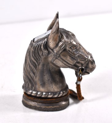 Lot 379 - A novelty silver plated table lighter in the...
