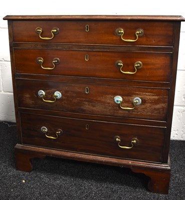 Lot 571 - A Georgian mahogany small chest of four...