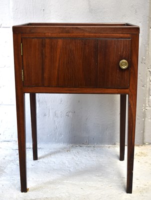 Lot 563 - A Georgian mahogany bedside cabinet, the...