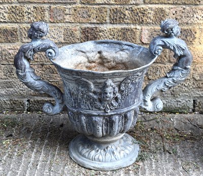 Lot 550 - An English Baroque style lead urn, the body...