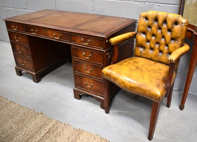 Lot 587 - A Vintage mahogany pedestal desk with leather...