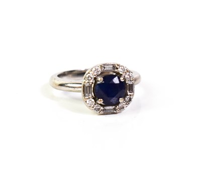 Lot 118 - An 18ct white gold, sapphire and diamond ring,...