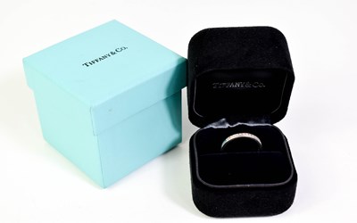 Lot 10 - A Tiffany & Co. platinum and diamond half hoop...