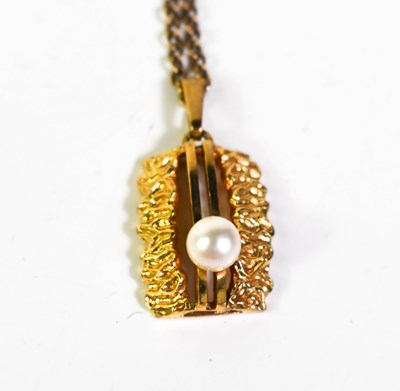 Lot 51 - A 9ct gold pendant on gilt metal chain, the...